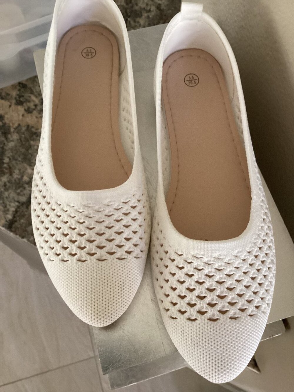 White cut-out women's flats, size 8.5, some discoloration